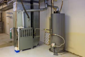 Conventional tank water heater and HVAC equipment in a mechanical room